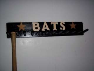 BLACK COLOR FINISH WITH WOOD LETTERS THAT READ: BATS AND BROWN STAR 