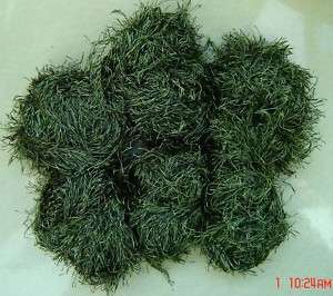 skeins fun fur yarn dark moss green mixed with black  