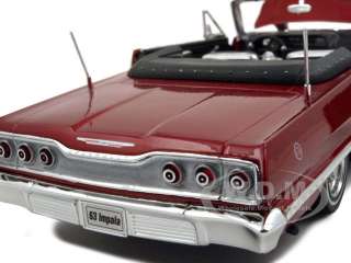   model of 1963 chevrolet impala convertible lowrider red die cast