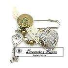 Court brooch of carved hearts, keys, pearl mix and mat