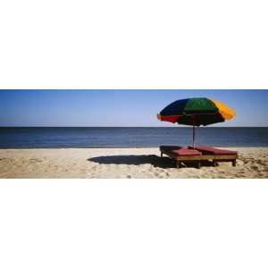 Two Beach Beds under an Umbrella on the Beach, Biloxi, Mississippi 